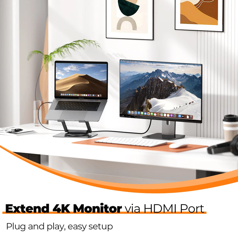 Two monitors on a desk with a laptop, keyboard, and mouse, featuring text about HDMI port extension.